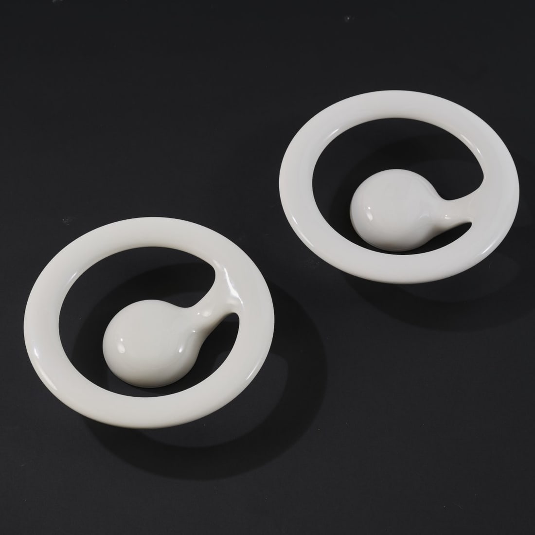 Marc Newson, Two wall lights 'Orotund', 2013: <p>&Oslash; 24.5 cm. <br />Flos, Brescia.<br />ABS plastic, polycarbonate, white. <br />One light fixture in original packaging with installation instructions and warranty