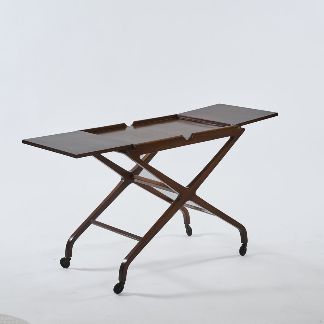 Cesare Lacca, Tea trolley, 1950s: <p>H. 70.5 x 131 (open) x 46.5 cm. <br />Walnut, walnut veneer, stained dark brown.</p>
