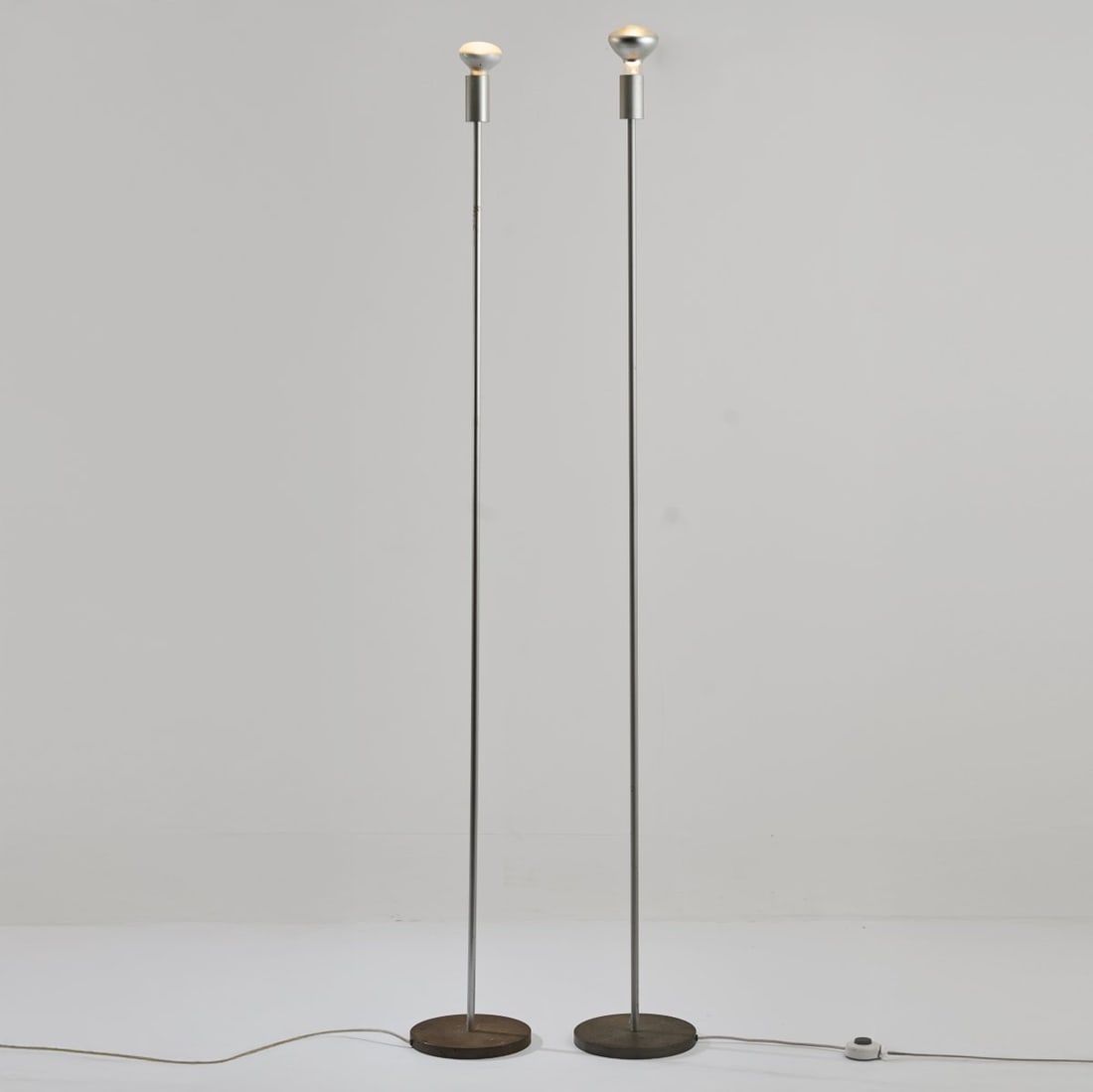 Hans Gugelot, Max Bill, Otl Aicher, Two floor lamps from the Ulm School of Design (HfG Ulm), c. 1955: <p>H. 184 cm (without light source). <br />Ulm School of Design (HfG). <br />Cast metal, metal tube, sheet metal, matt chrome-plated.</p>