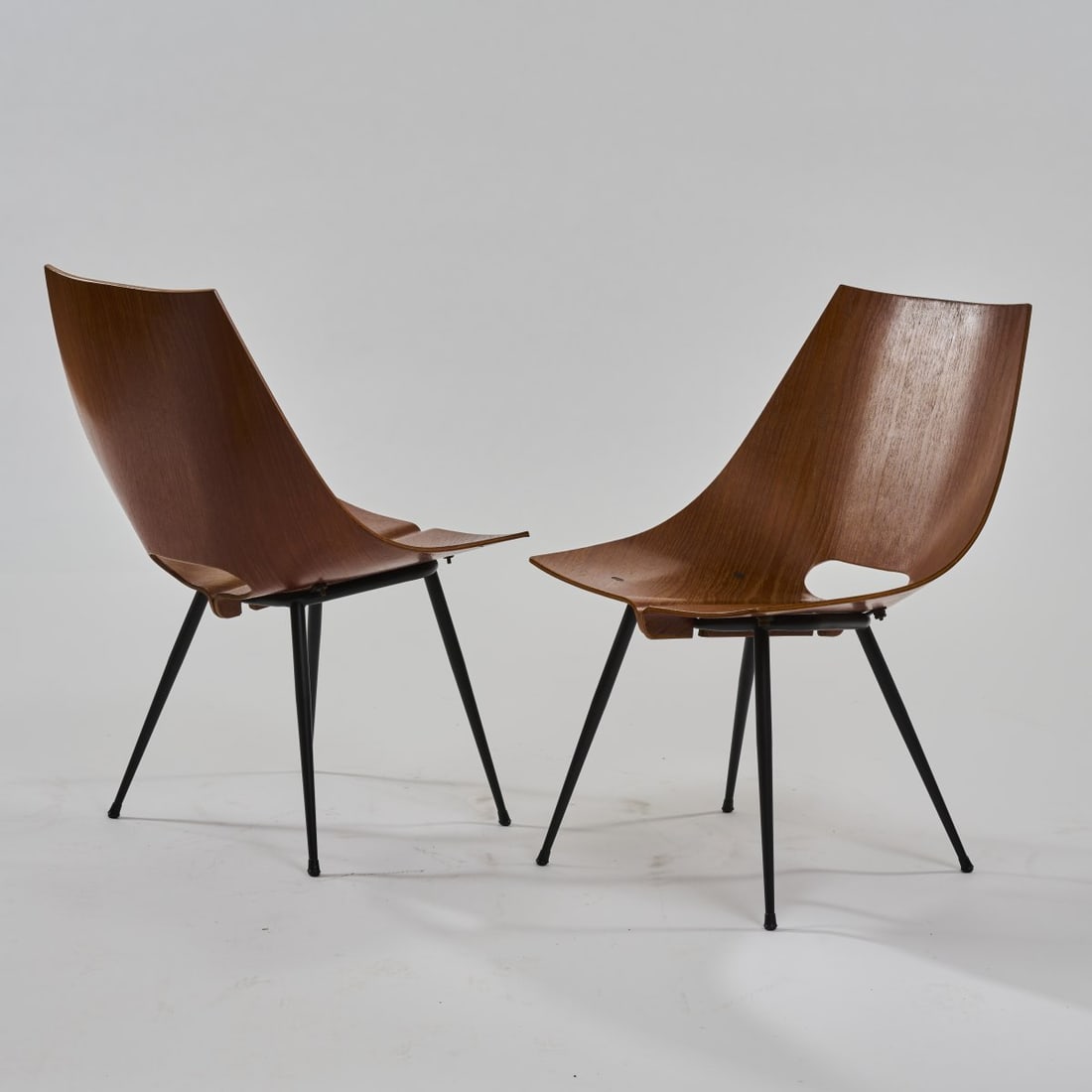 Carlo Ratti, Two chairs, c. 1955: <p>H. 75 x 48 x 58.5 cm. <br />Industria Legni Curvati, Lissone (attributed). <br />Plywood with walnut veneer, tubular metal, varnished black.</p>