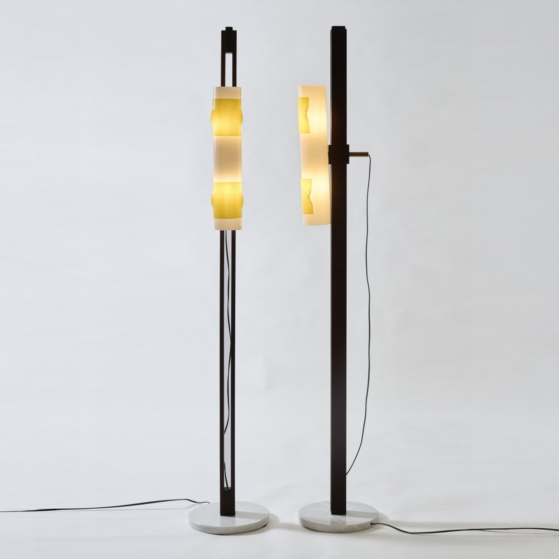 Stilux, Milan, Two floor lamps, c. 1958: <p>H. 179 cm, foot: &Oslash; 29 cm. <br />White marble, teak wood, white and yellow plexiglass, brass tube. </p>