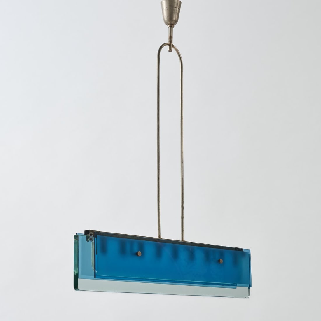Fontana Arte, Milan, Ceiling light, 1960s: <p>H. 105 x 90 x 10 cm.<br />Glass block, colorless, blue, frosted on one side, sheet and tubular brass. </p>