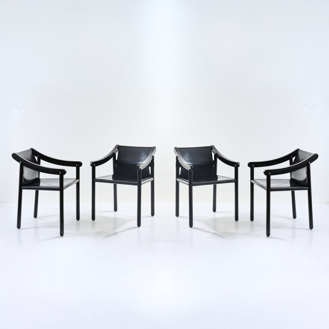 Vico Magistretti, Four armchairs '905', 1964: <p>H. 75.5 x 56 x 58 cm. <br />Cassina, Milan. <br />Wood, lacquered black, black leather.</p>