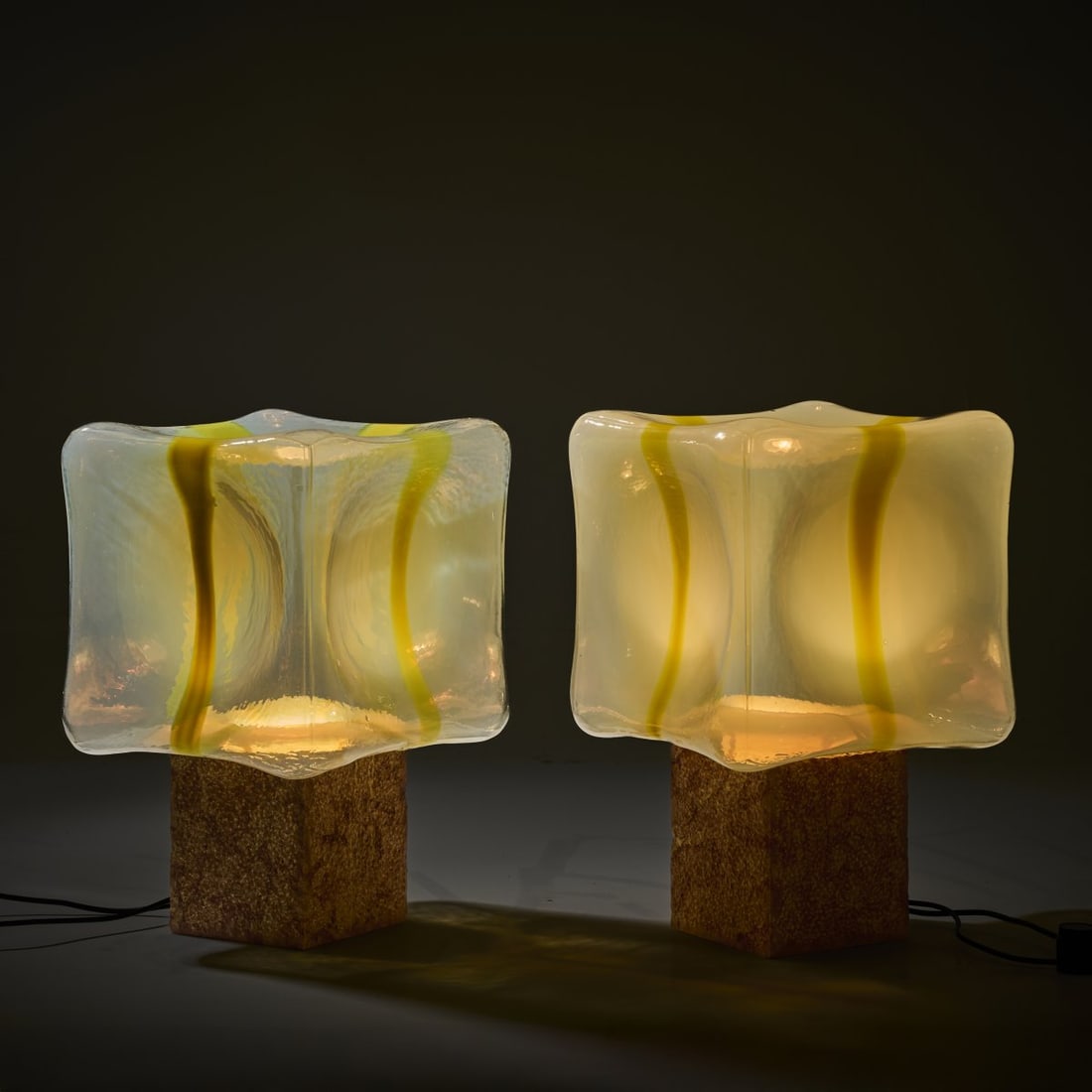 Roberto Pamio; Renato Toso, Two 'Sierra' table lights, 1975: <p>H. 55.5 x 36 x 36 cm. <br />Leucos, Milan. <br />Glass, opal white and yellow, marble base. <br />Marked: Manufacturer's