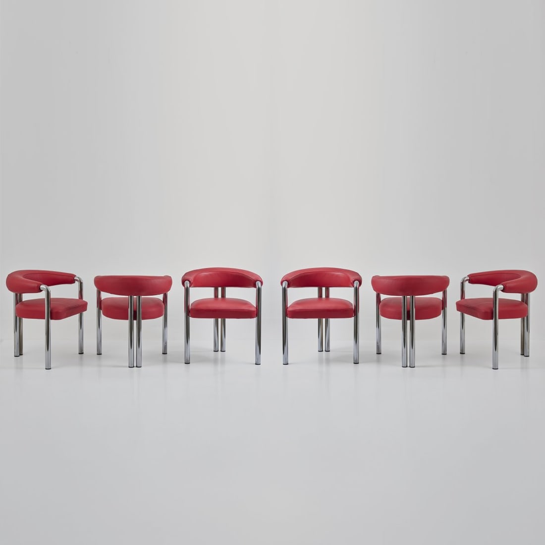 De Sede Design Team, Six armchairs 'DS 200', 1980s: <p>H. 70 x 63 x 55 cm. <br />DeSede, Klingnau. <br />Chrome-plated tubular metal, red leather. </p>
