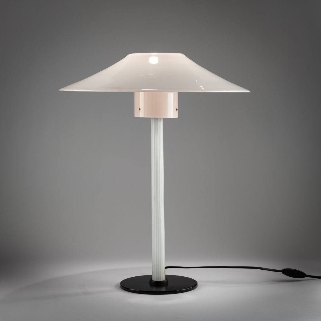 Cini Boeri, Table light 'Chiara', 1984: <p>H. 56 cm, &Oslash; 46.5 cm. <br />Venini, Murano, 1988. <br />Cast metal, black, colorless glass with fused white rods, opal white and light pink. Marked: Venini 88 (engraved)
