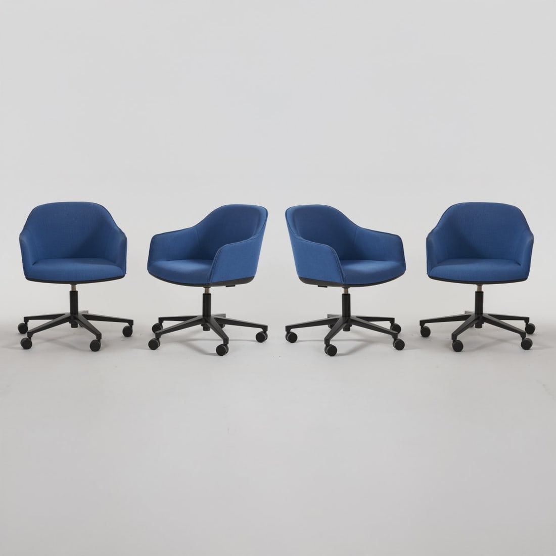 Ronan Bouroullec; Erwan Bouroullec, Four office swivel chairs 'Softshell Chair', 2008 (design): <p>H. 76.5 - 89.5 x 62 x 56.5 cm. <br />Vitra, Birsfelden, 2017. <br />Tubular aluminum frame, partially lacquered black, polyamide shell, blue textile cover. Marked: Manufacturer's