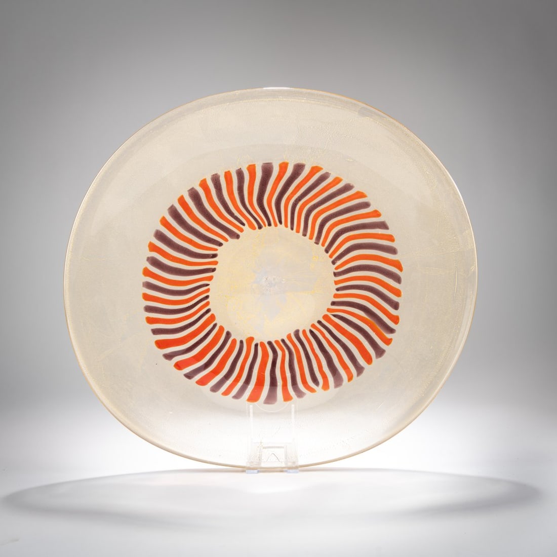 Anzolo Fuga, Decorative bowl 'a canne', c. 1956: <p>Model No. 13479. 39.5 x 42 cm. Execution: A.Ve.M. Overlaid glass, colorless, with embedded shattered gold foil. Fused rods in orange and