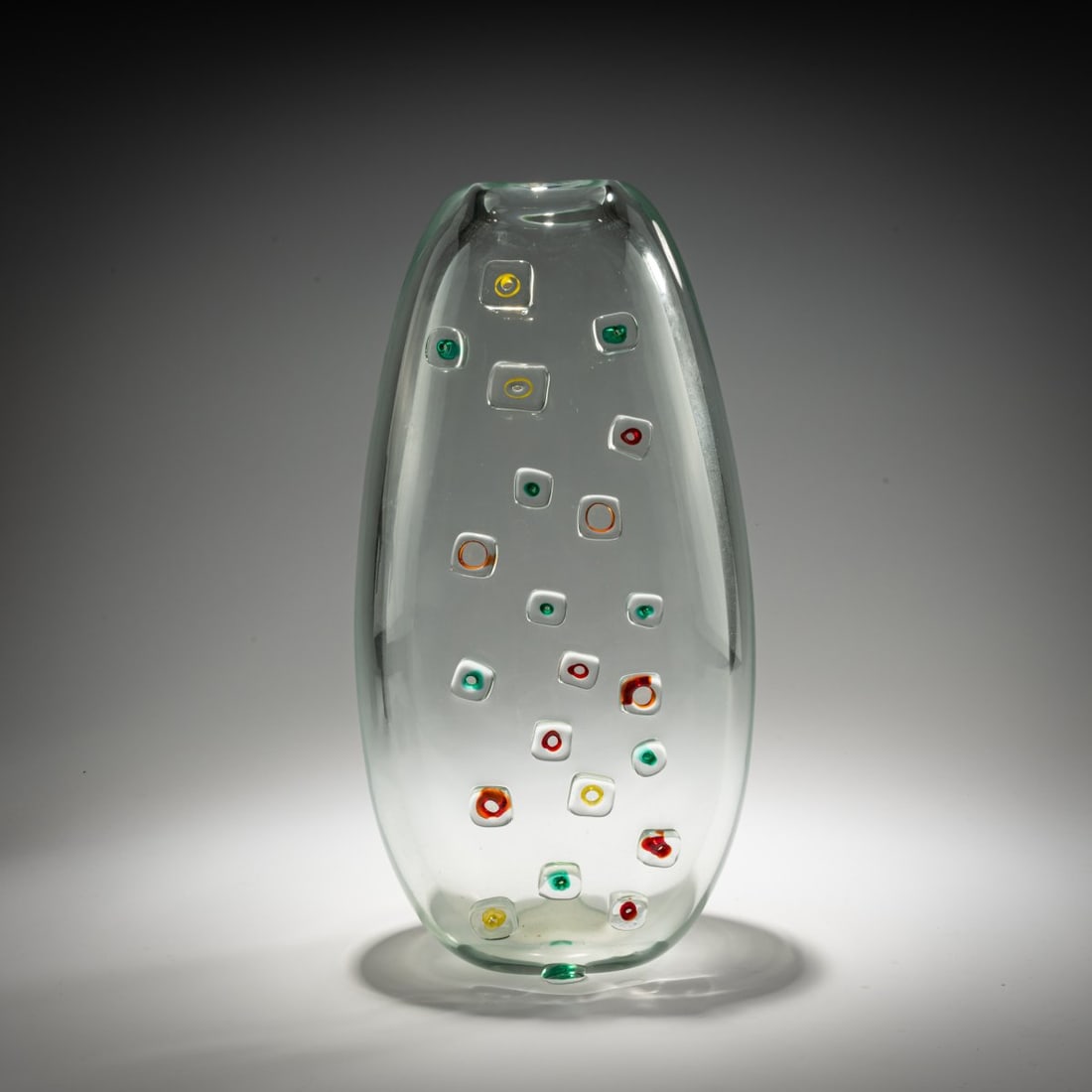 Alfredo Barbini, Vase 'Finestre', c. 1960: <p>H. 37 cm. Execution: Vetreria Alfredo Barbini. Colorless glass with fused rings featuring red, green, and yellow cores. Marked: A. Barbini (engraved). </p>