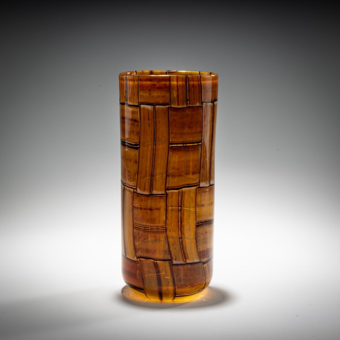 Ercole Barovier, Vase 'Tessere Ambra', 1957: <p>H. 24,7 cm. Execution: Barovier &amp; Toso. Colorless glass with fused, rectangular glass platelets in ochre brown and opal white with metal oxides, outlined in dark purple. Bottom