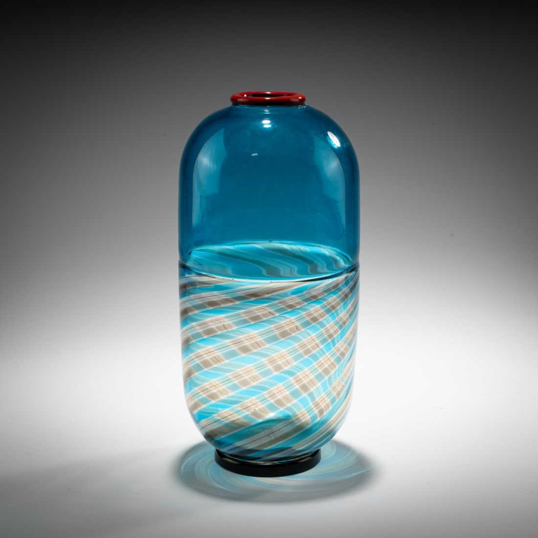 Yoichi Ohira, Vase 'Incalmo', 1990: <p>H. 23.5 cm. Execution: de Maio. Multicolored glass, upper part of the body light blue, fused colorless glass with fused bands in gray and light blue, red rim, deep violet base. Bottom