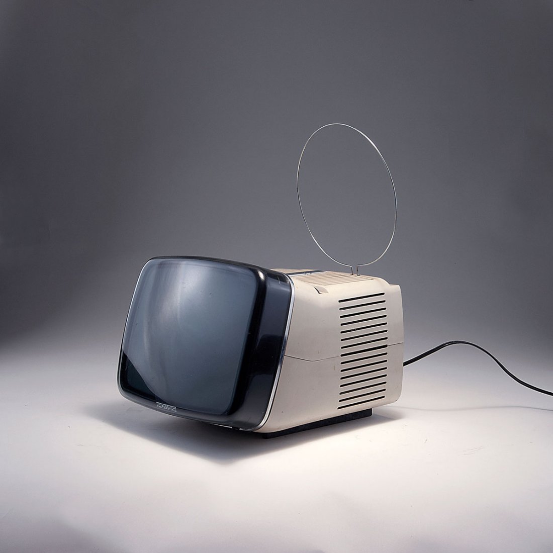 Marco Zanuso; Richard Sapper. 'Algol 11' TV-set, 1964. : Marco Zanuso; Richard Sapper. 'Algol 11' TV-set, 1964. H. 23.5 x 26 x 31 cm. Made by Brionvega, Milan. Creme white plastic, smoke black perspex. Marked: BRIONVEGA, algol 11''.