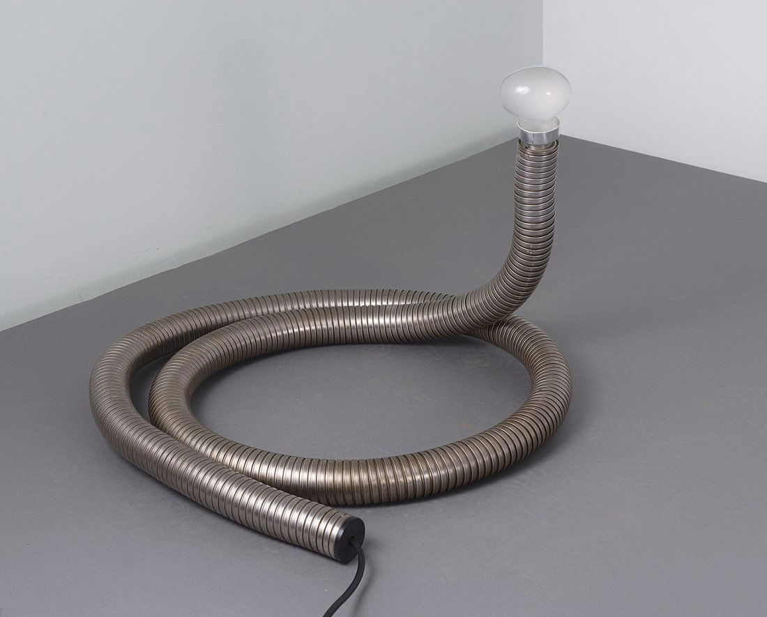 Giuseppe Ostuni. Prototype 'Serpent' light, c1965. L. 3: Giuseppe Ostuni. Prototype 'Serpent' light, c1965. L. 306 cm; D. 5 cm. Stainless steel hose, aluminium, plastic, 'Cornalux' bulb.