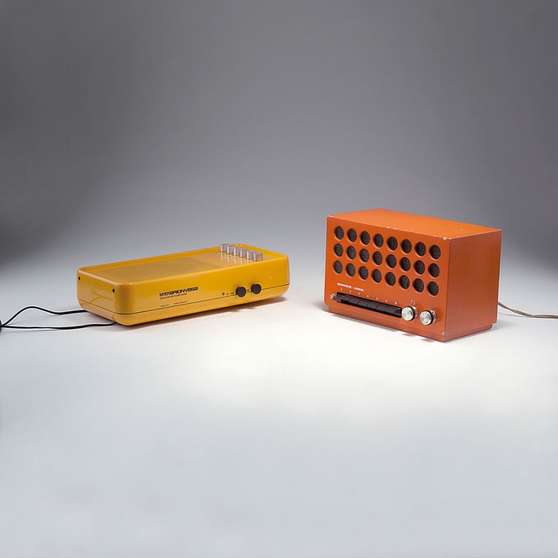 Achille Castiglioni; Pier Giacomo Castiglioni; Richard : Achille Castiglioni; Pier Giacomo Castiglioni; Richard Sapper. 'FD 1101' radio, 1968; 'Crans Jeunesse - 47 HS' radio, 1960s. H. 8.6 x 34.5 x 16 cm-H. 16.7 x 26.2 x 13.2 cm. Made by Brionvega, Milan. Y