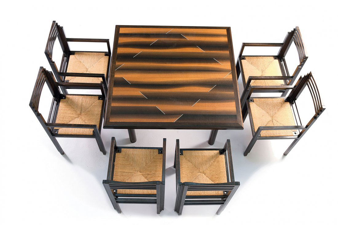 Studio Hans Hollein; Beate Kugel. Dining table and six : Studio Hans Hollein; Beate Kugel. Dining table and six chairs, c1986. Dining table: H. 75 x 127 x 127 cm; chairs: H. 95.5 x 48.5 x 52 cm. Table top of moor oak, aluminium, legs of black tubular steel,