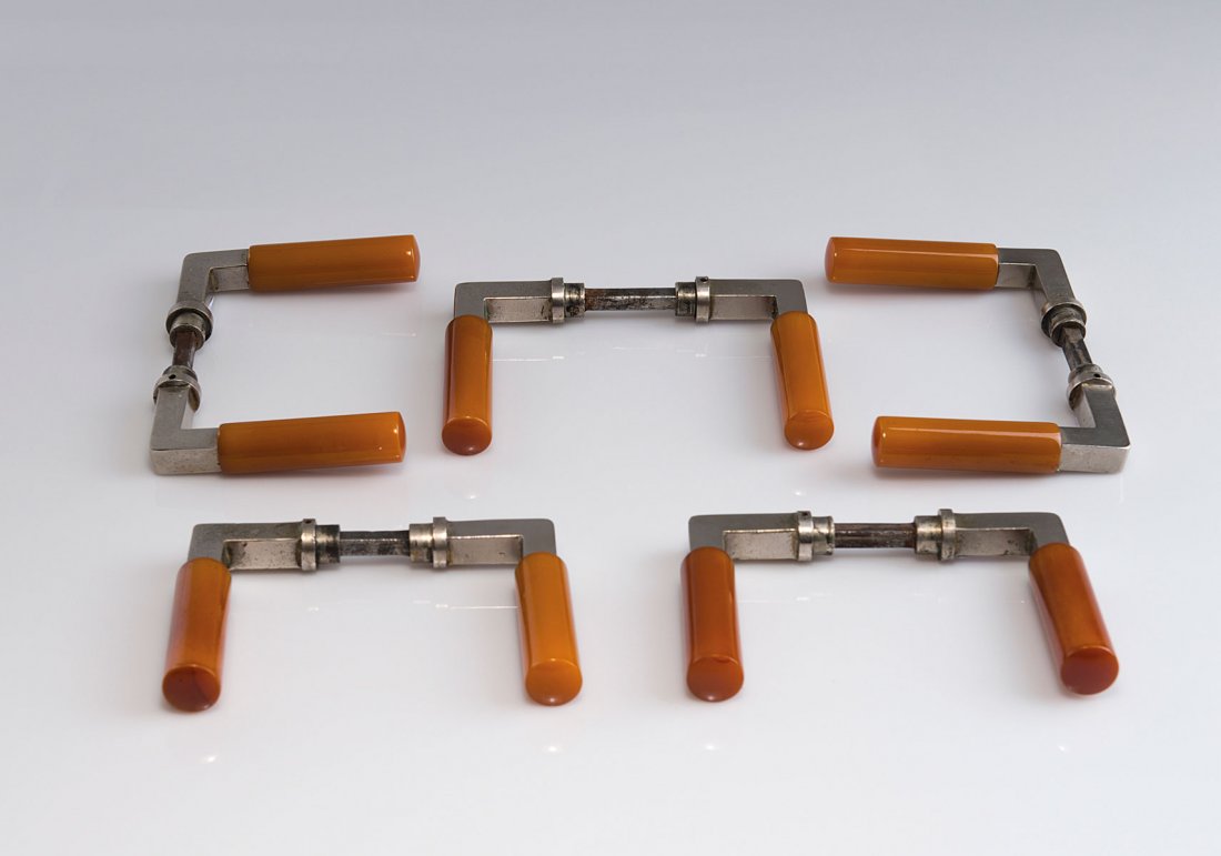 Walter Gropius. Five pairs of door handles, 1923. L. 11: Walter Gropius. Five pairs of door handles, 1923. L. 11 cm. Made by Wilhelm Engstfeld, Heiligenhaus. Nickel silver, amber galalith. Marked: wehag NICKSIL.