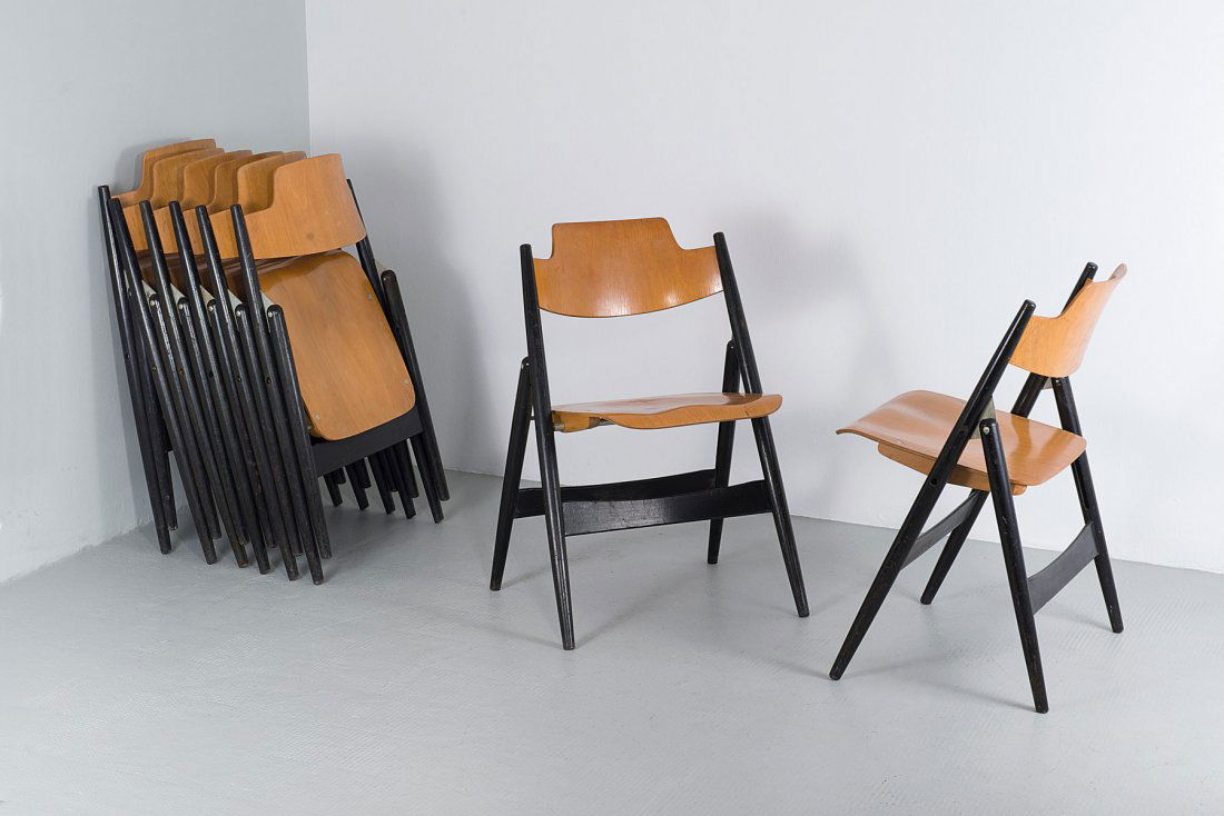 Egon Eiermann. Eight 'SE 18' folding chairs, 1953. H. 7: Egon Eiermann. Eight 'SE 18' folding chairs, 1953. H. 76 x 50.5 x 42 cm. Made by Wilde & Spieth, Esslingen. Beech, part painted black, beech plywood.
