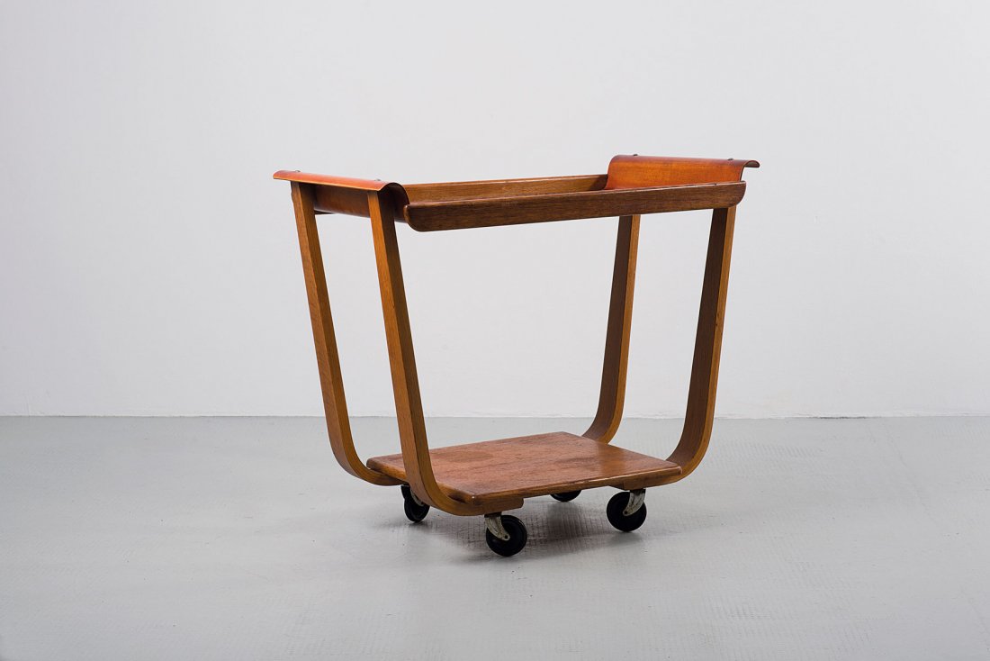Cees Braakman. Serving cart, 1952. H. 68 x 80 x 45 cm. : Cees Braakman. Serving cart, 1952. H. 68 x 80 x 45 cm. Made by UMS Pastoe, Utrecht. Plywood, stained red, oakwood, plastic wheels.