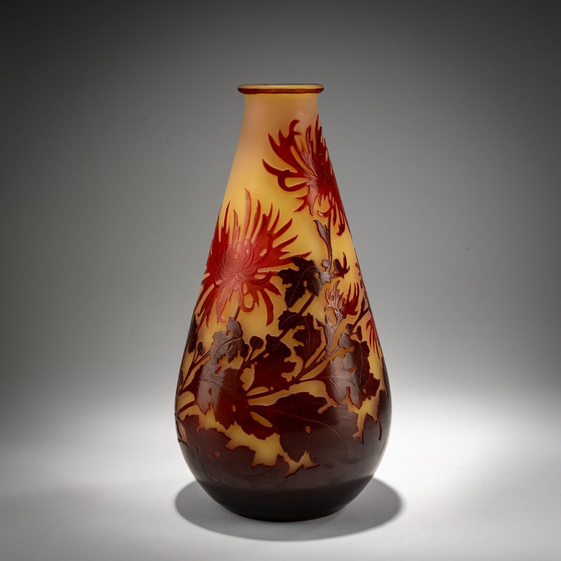 Etablissements Gallé, Nancy, 'Chrysanthèmes' Vase, 1925-36: <p>H. 31.5 cm. Overlaid glass, colorless, vanilla yellow, orange, and dark red. Etched decoration with chrysanthemums. Signed: Gall&eacute; (raised). </p>