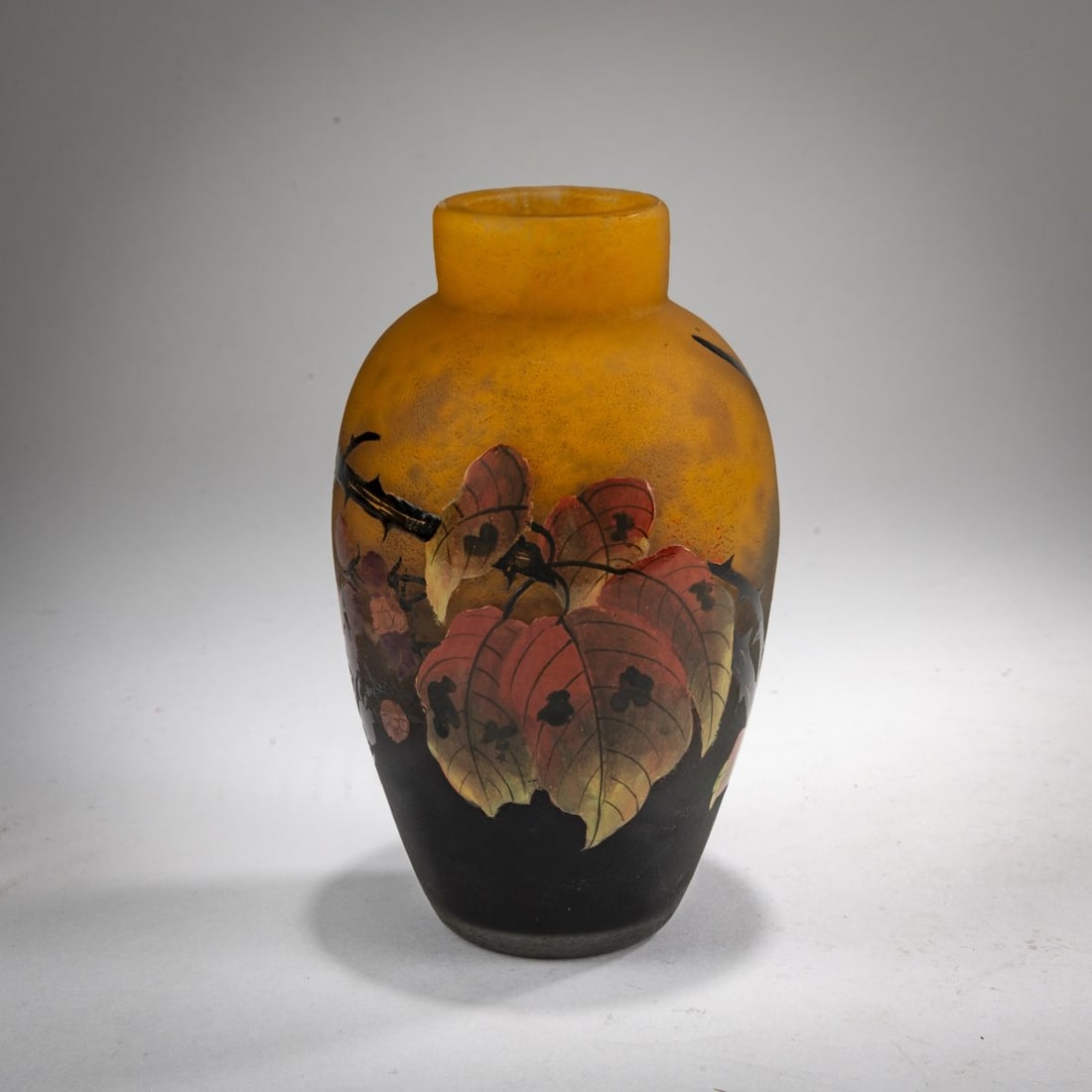 Muller Frères, Lunéville, Small Vase 'Framboises', c. 1925: <p>H. 14 cm. Cased glass, colorless, with orange and violet powder inclusions. Etched and polychrome enameled decoration with raspberry branches and fruit. Signed: MULLER FRES LUNEVILLE (black s