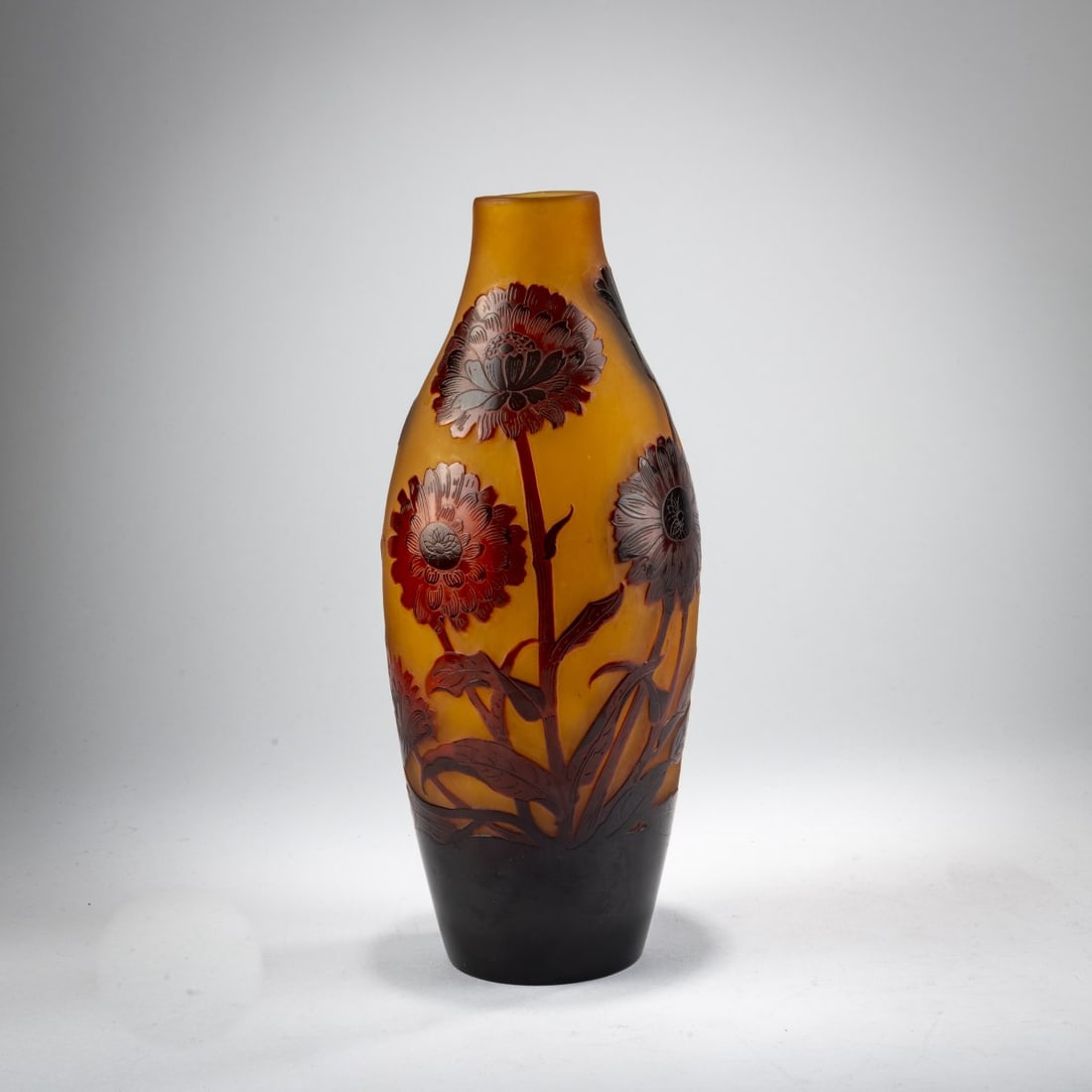 Paul Nicolas, Nancy, Vase 'Girofles', 1919-23: <p>H. 25.2 cm. Cased glass, colorless, amber yellow, and red. Etched decoration with carnations in an evening mood. Signed: d'Argental, Lorraine Cross (raised).</p>