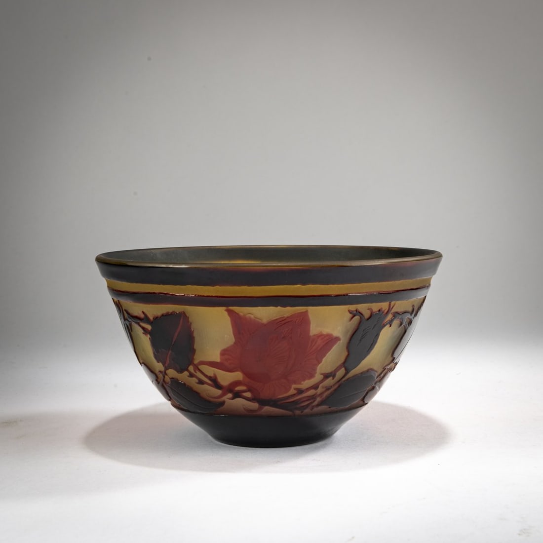 Paul Nicolas, Nancy, Bowl 'Roses', 1925-30: <p>H. 8.2 cm, &Oslash; 15.2 cm. Cased glass, colorless, amber yellow, dark brown, and red. Etched decoration with roses in an evening mood. Signed: PNicolas Nancy (raised).</p>