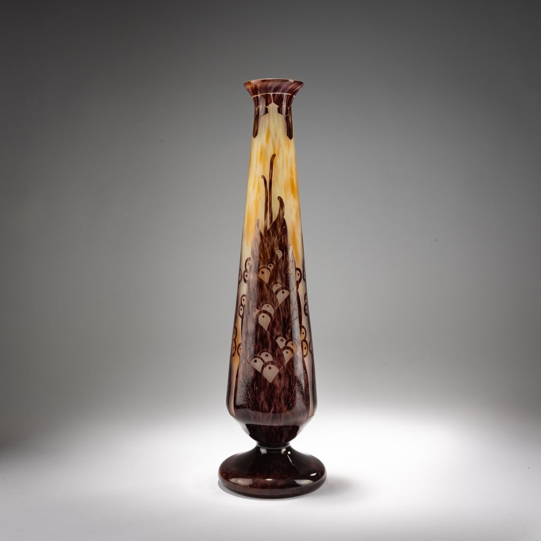 Schneider, Epinay-sur-Seine, Vase 'Lauries', 1924-27: <p>H. 48.2 cm. Overlaid glass, colorless with white and orange-yellow powder inclusions, dark violet enamel fusions. Etched laurel decoration. Foot signed: Le Verre Fran&ccedil;ais (needle e