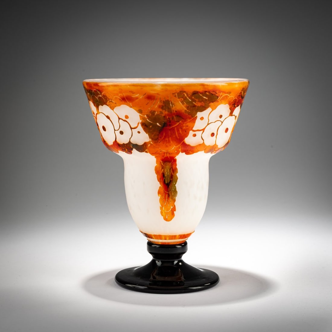 Schneider, Epinay-sur-Seine, 'Glycines' Vase, 1927-28: <p>H. 18.7 cm. Overlaid glass, colorless, with white powder inclusions, orange, red, and green enamel fusions with etched wisteria decoration. Dark violet foot. Signed: Charder (raised). Foot si