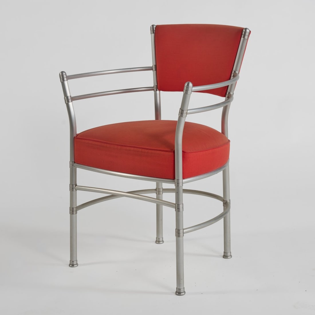 Warren McArthur, Armchair, 1930s (design): <p>H. 84 x 63.5 x 58 cm. <br />ClassiCon, Munich, 1990s. <br />Aluminum tube, red textile cover. <br />Marked: ClassiCon, AA 20113, artist's signature (embossed). </p>