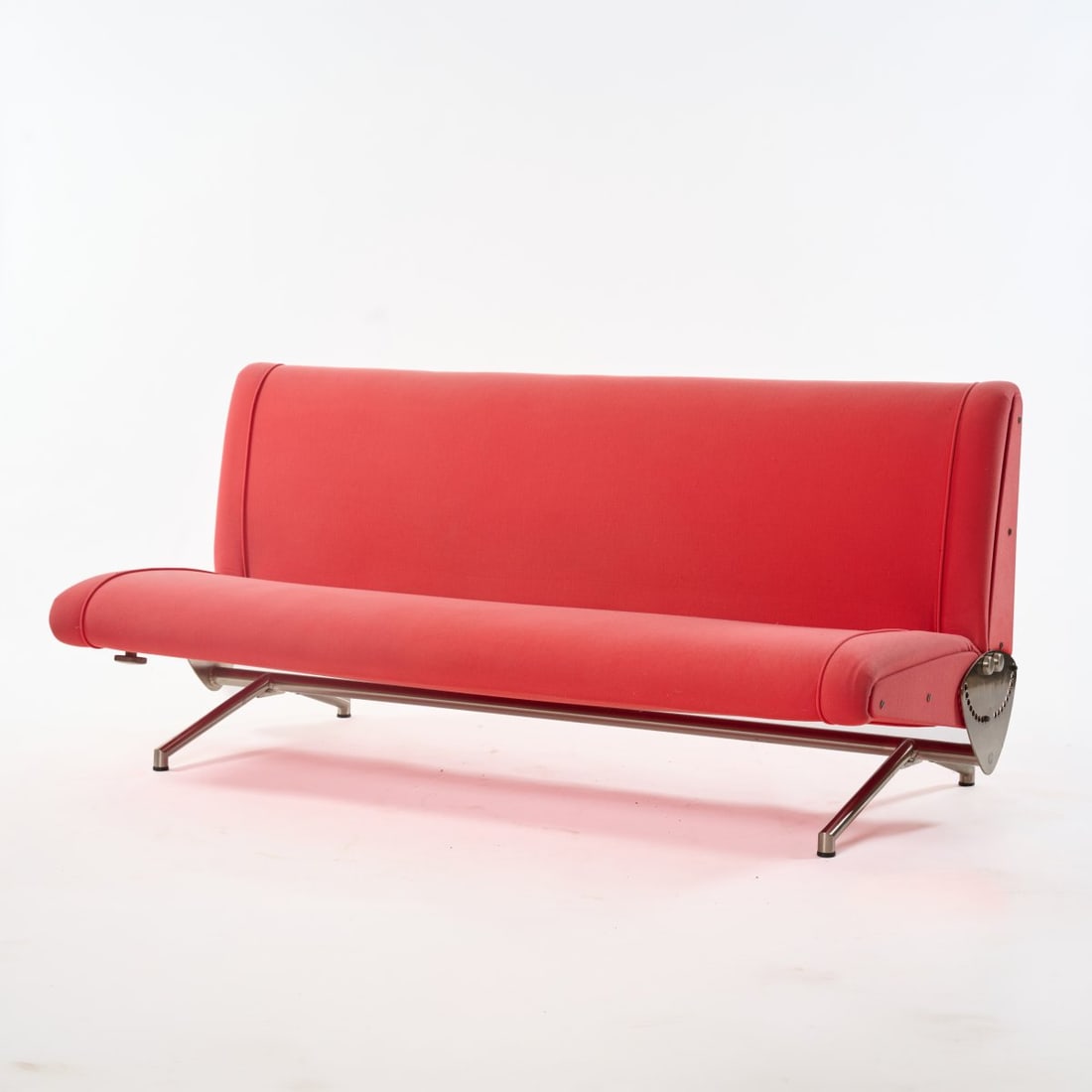 Osvaldo Borsani, Sofa / bed 'D 70', 1954 (design): <p>H. 80 x 191 x 95-140 cm. <br />Tecno, Milan. <br />Metal tube, sheet metal, nickel plated, sheet, brass, red textile fabric. <br />Marked: Manufacturer's metal