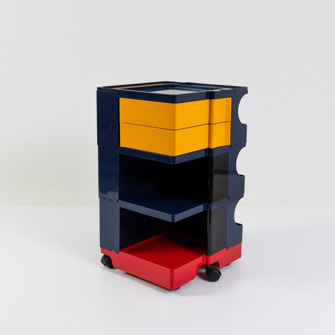 Joe Colombo , Container on casters 'Boby', 1970 (design): <p>H. 73.5 x 43 x 42 cm. <br />Bieffeplast, Padua. <br />Yellow, blue, red, and black ABS plastic, metal screws. <br />Marked: Manufacturer and designer's details, facsimile