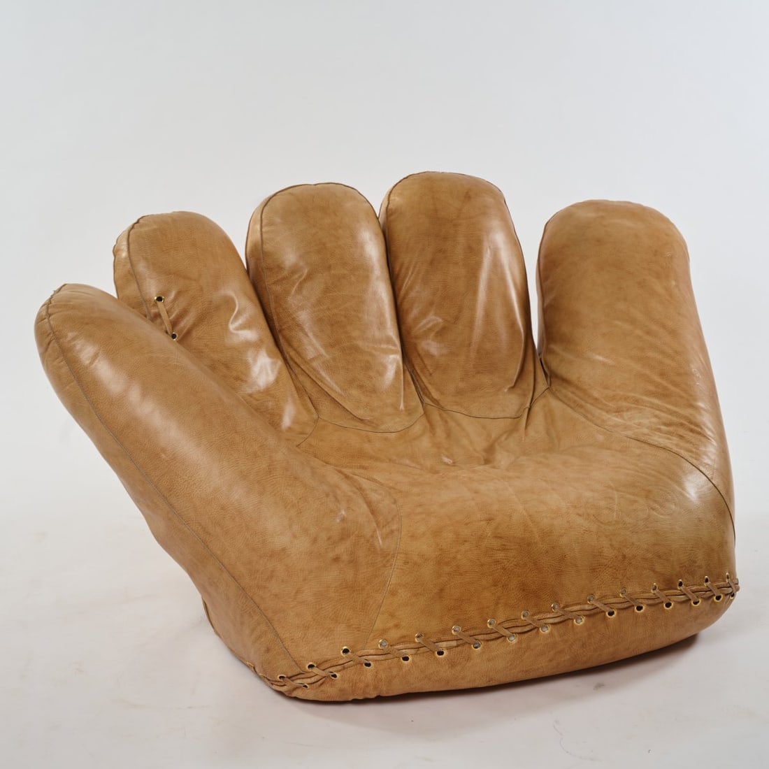 Jonathan De Pas; Donato d'Urbino; Paolo Lomazzi, Easy chair 'Joe', 1971 (design): <p>H. 95 x 189 x 107 cm. <br />Poltronova, Pistoia. <br />Light brown leather, brass rivets, black plastic, castors. <br />Marked: manufacturer's mark (bleached).