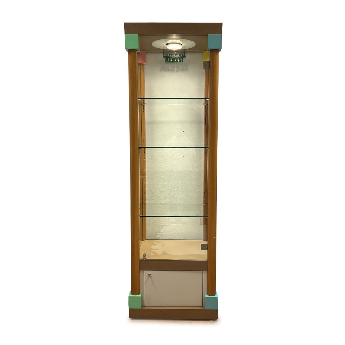 Ettore Sottsass (attributed), Display case for Alessi products, 1980s (design): <p>H. 245 x 72 x 62 cm. <br />A. Pradella &amp; Figli for Alessi, Crusinallo. <br />Maple wood, lacquered in brown, pink, green, blue and yellow, colorless glass, white plastic.&