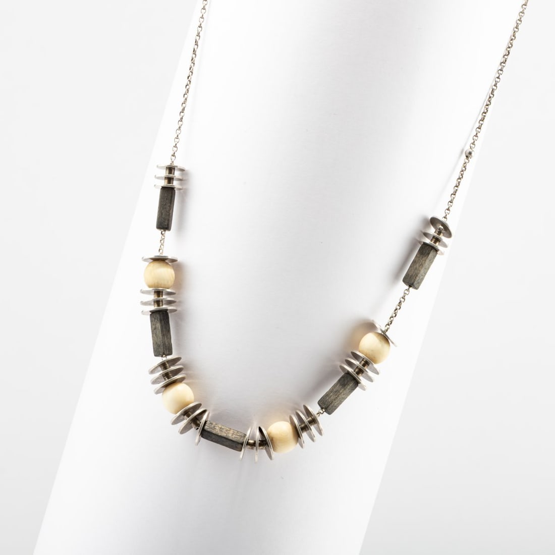Bauhaus (attributed), Necklace, 1920s: <p>Silver, four bone spheres, ebonized wood. <br />Total weight 17.58 grams. L. 4390 mm. <br />Unmarked. </p><hr><p>Literature:</p><p>Cf. Weber,