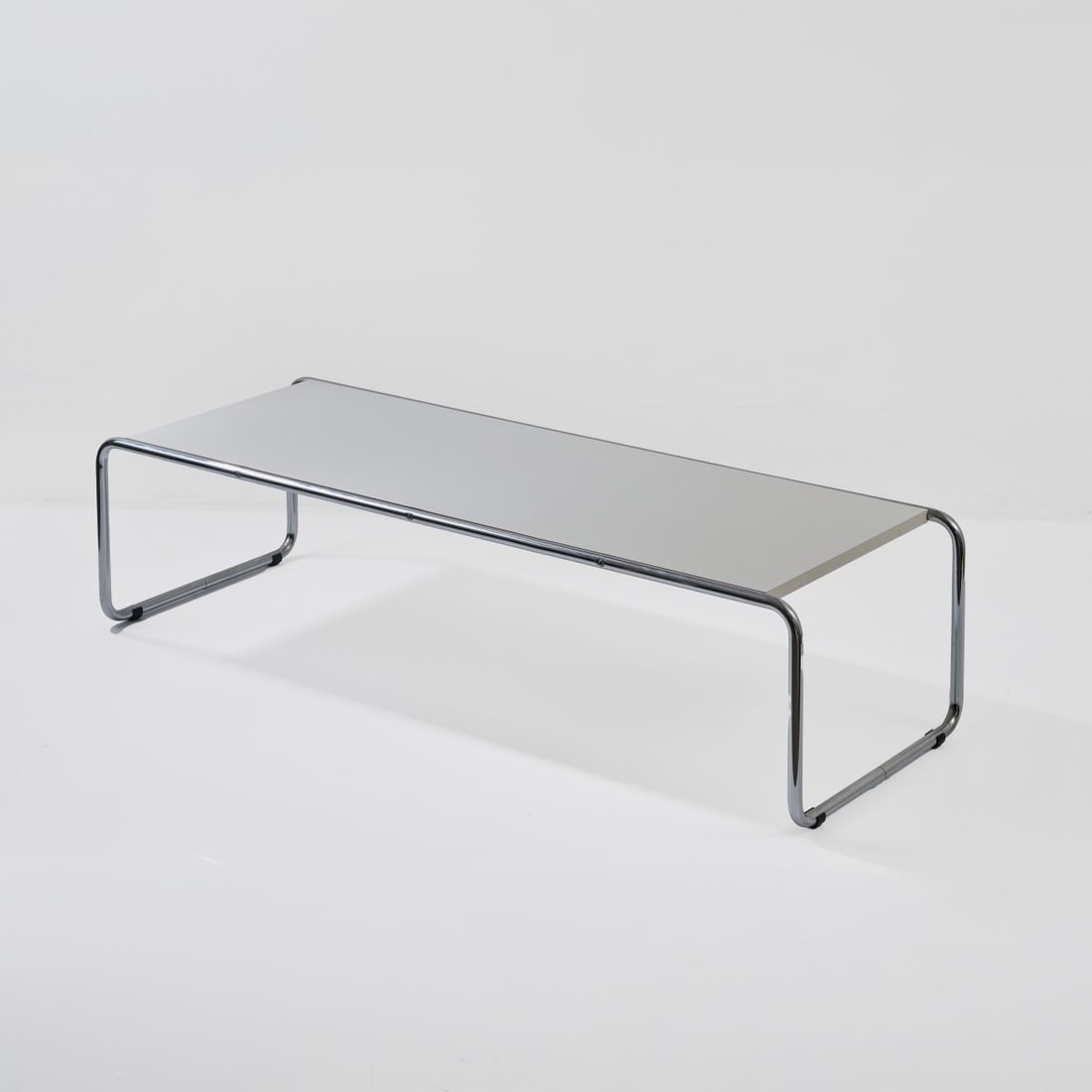 Marcel Breuer, 'B9' Side table, 1925 (design): <p>H. 35 x 136 x 48 cm. <br />Gavina, Milan (attributed). <br />Chrome-plated tubular steel, white lacquered wood.</p>