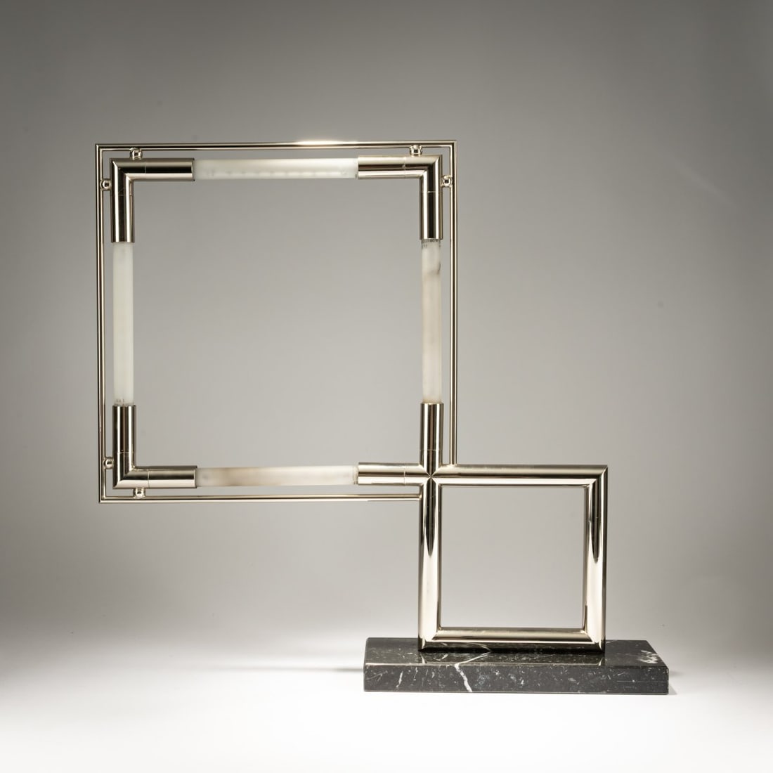 Jacques Adnet, 'Quadro' table light, 1929 (design): <p>H. 58 x 60 x 11 cm. <br />France, probably 1970/1980s. <br />Nickel-plated metal tube, fluorescent tubes, black marble, sheet metal.</p>