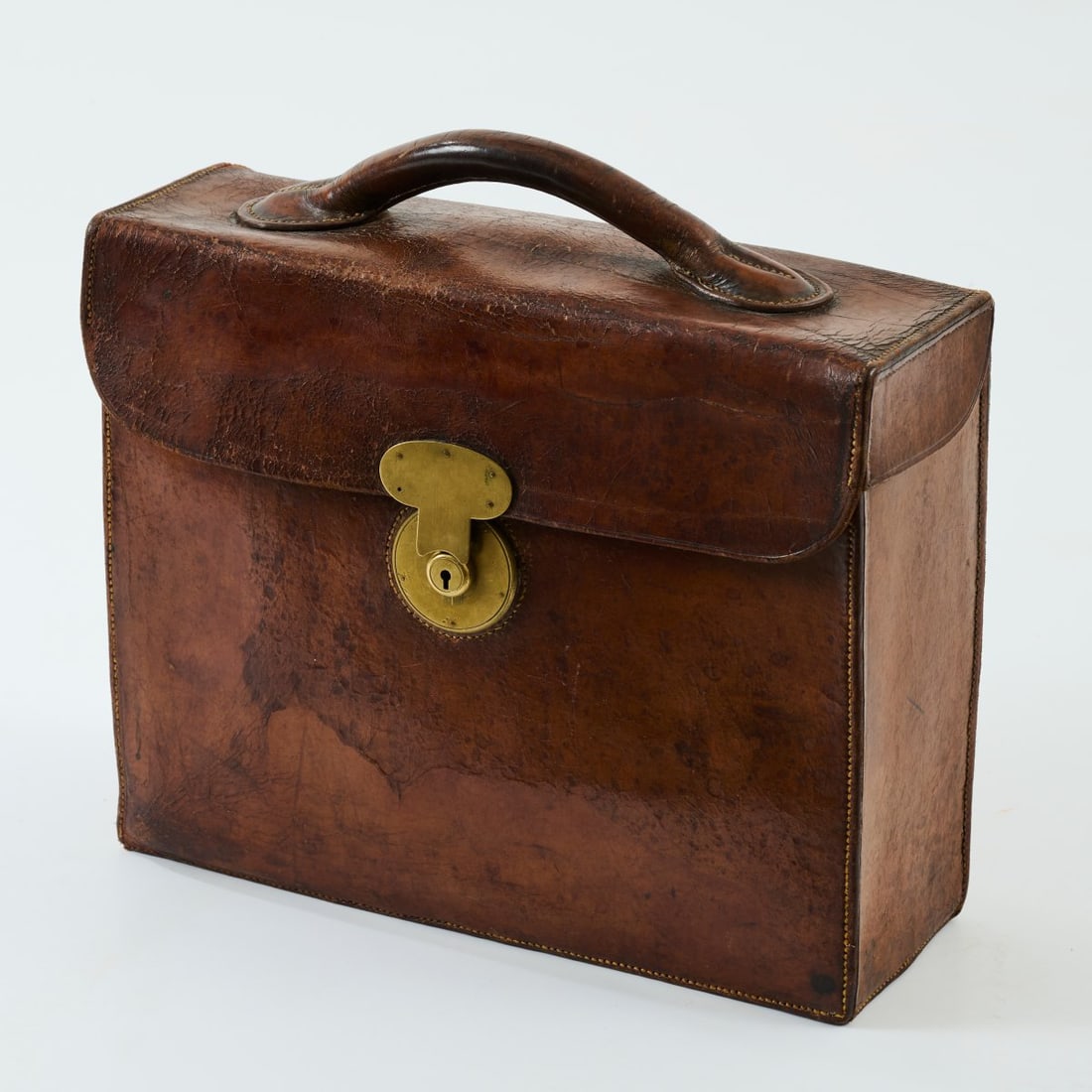 , Briefcase, 1920s: <p>H. 37 x 39 x 14 cm.<br /><br />Dark brown leather, brass fittings.<br />Marked: OBS (stamped). </p><hr><p>Literature:</p><p>From the Otto