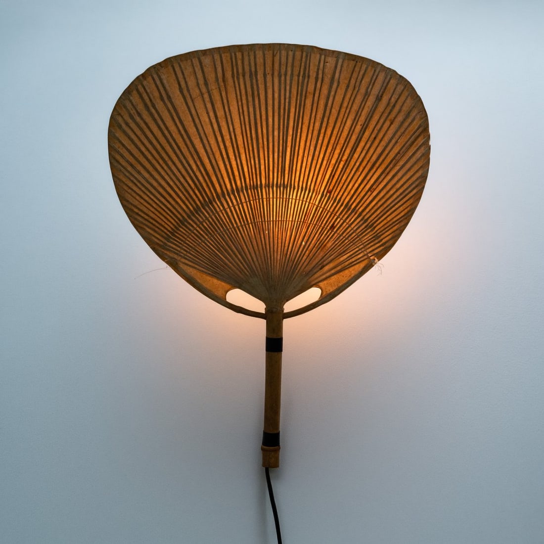 Ingo Maurer , Wall light 'Uchiwa III', 1973 (design): <p>H. 75 x 57 x 12.5 cm. <br />Design M, Ingo Maurer, Munich. <br />Bamboo cane, rice paper.</p><hr><p>Literature:</p><p>Cf. Dessecker (Ed.), Ingo