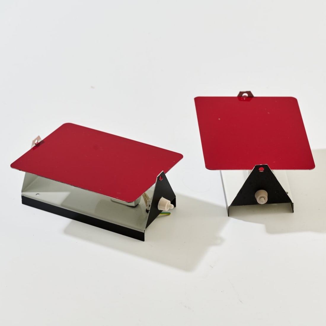 Charlotte Perriand , Two wall appliques 'CP-1', 1963 (design): <p>H. 17.5 x 12.5 x 7 cm. <br />Steph Simon, Paris (originally); SCE, France. <br />Sheet metal, painted red, black and white. <br />Marked: Manufacturer's