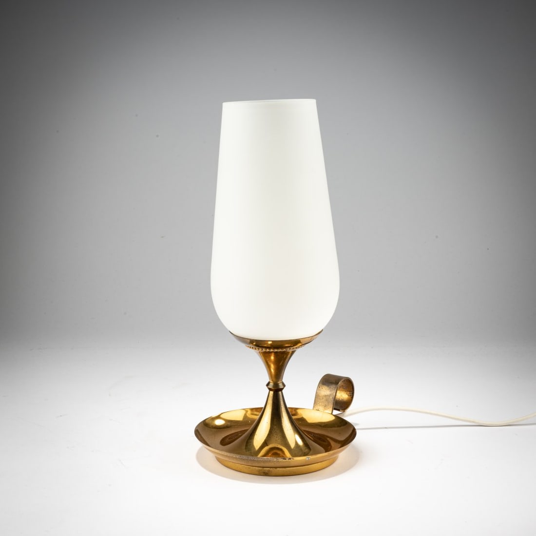 Stilnovo, Milan, Table light '8047', c. 1960 (design): <p>H. 28 cm. <br />Brass sheet, white glass. <br />Marked: STILNOVO-ITALY (embossed), remnant of a manufacturer's label. </p>