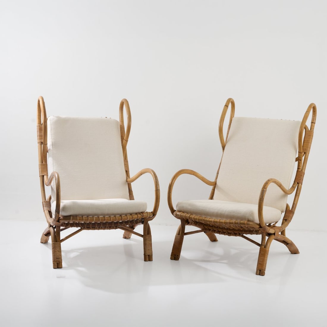 Gio Ponti, Two armchairs 'Continuum - BP16', c. 1963 (design): <p>H. 99 x 63 x 98 cm. <br />Pierantonio Bonacina, Como. <br />Bamboo rod, rattan fleck, cr&egrave;me-white textile material.