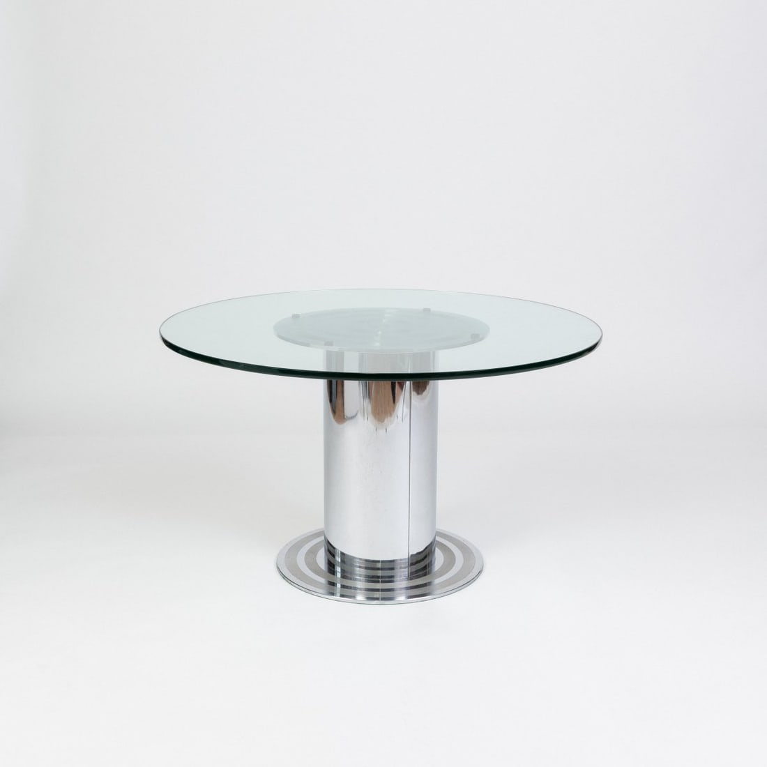 Italy, Table, 1970s (design): <p>H. 70 cm, &Oslash; 120 cm. <br />Sheet metal, tubular metal, chrome-plated, colorless glass.</p>