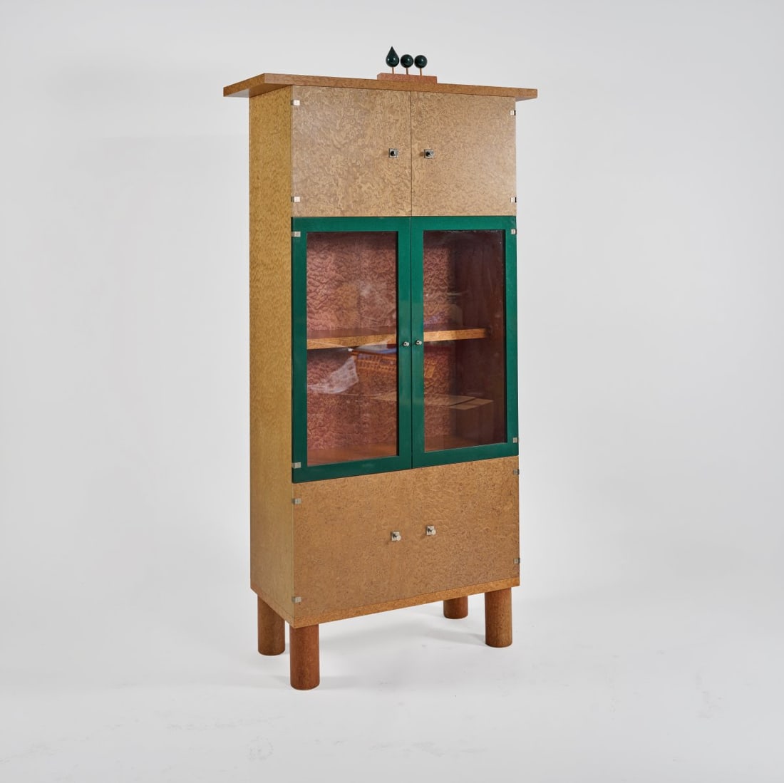 Ettore Sottsass; Marco Zanini, Shelving unit 'Donau', 1986/1993 (design): <p>H. 219 x 110.5 x 48 cm. <br />Franz Leitner, St. Lambrecht, Austria. <br />Wooden box construction, burl wood veneer, polychrome staining, wood, painted metallic green, metal fitt