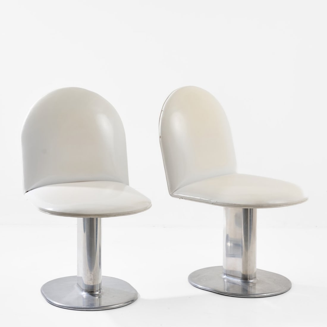 Ettore Sottsass, Two 'Harlow' chairs, 1971 (design): <p>H. 81 x 47 x 61.5 cm. <br />Poltronova, Pistoia. <br />Cast aluminum, chrome-plated sheet metal, white plastic cover. <br />Marked: Manufacturer's stamp with designer inform