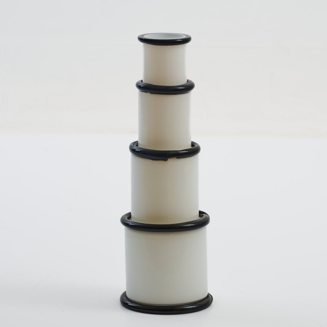 Ettore Sottsass , Vase 'Morosina', 1974 (design): <p>H. 39.5 cm, &Oslash; 7.5&ndash;13.5 cm. <br />Vistosi, Murano. <br />Glass, white and black. <br />Marked: E. SOTTSASS 156/250 VISTOSI (incised).</p><hr>