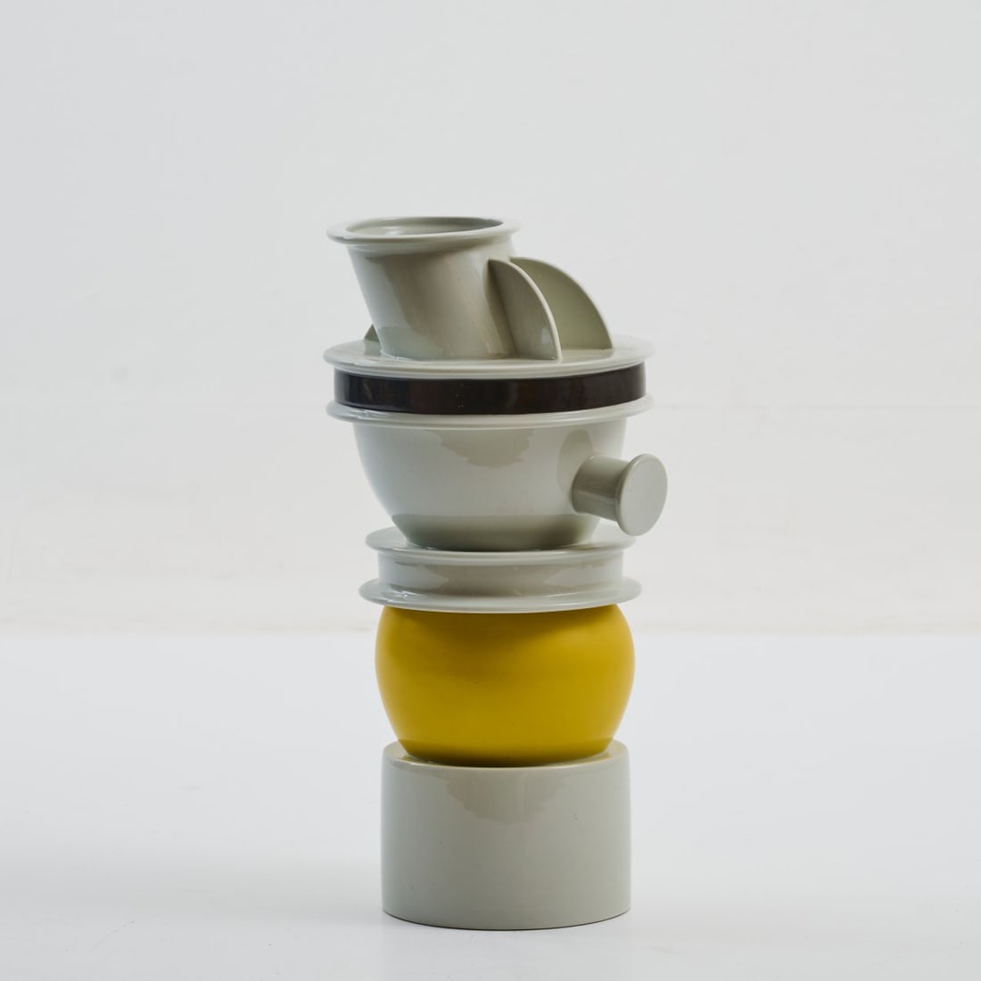 Ettore Sottsass , Vase object 'Euphrates', 1983 (design): <p>H. 39.5 cm. <br />Memphis, Milan. <br />Porcelain, white, glazed, with black and yellow overglaze. <br />Marked: E. Sottsass per Memphis.</p><hr><p>Literat