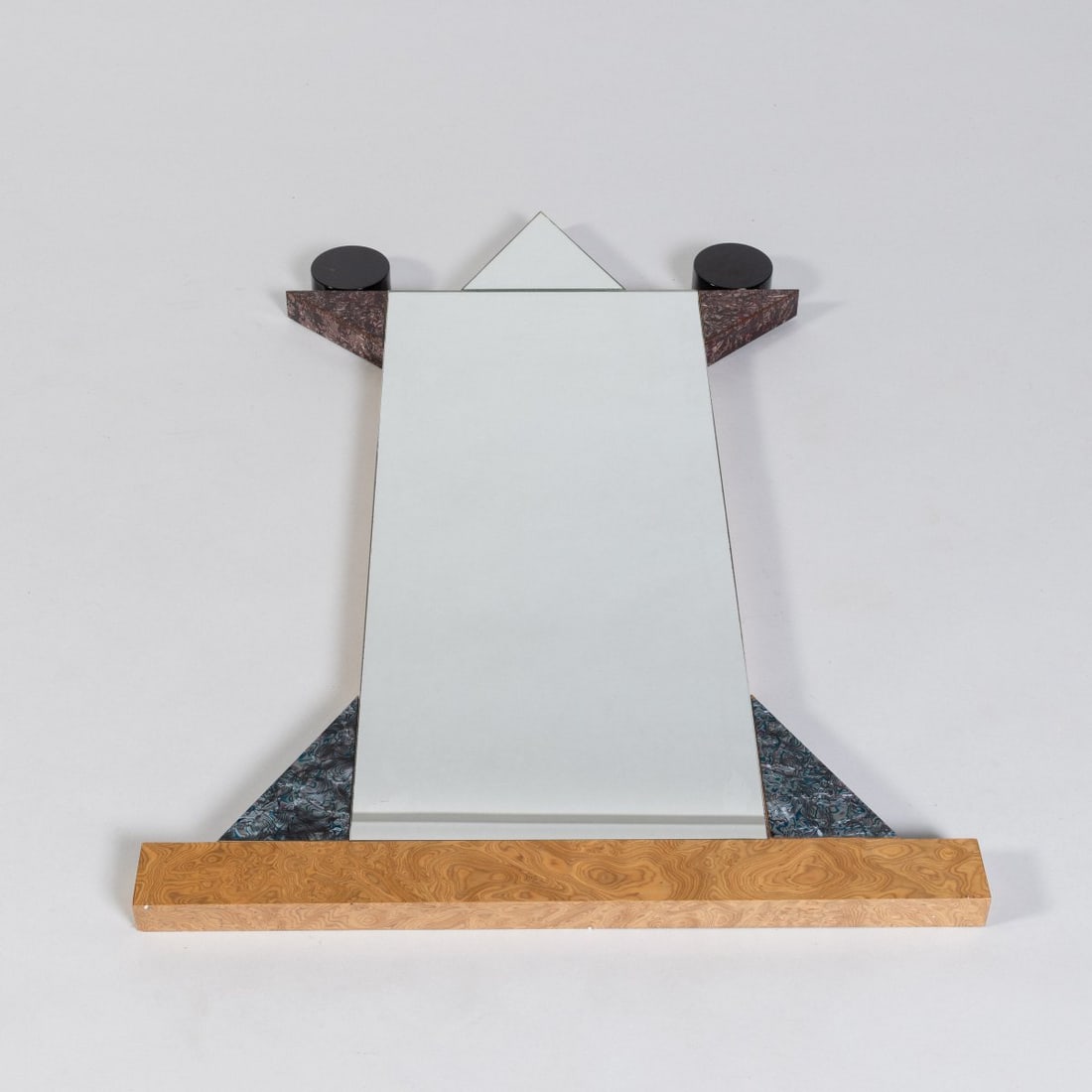 Ettore Sottsass, Wall mirror 'Diva', 1984 (design): <p>H. 109.5 x 76 x 4 cm. <br />Memphis, Milan.<br />Wood, lacquered black, laminate, mirror glass. <br />Marked: Manufacturer's metal plaque Memphis Milano E. SOTTSASS 1984, MA