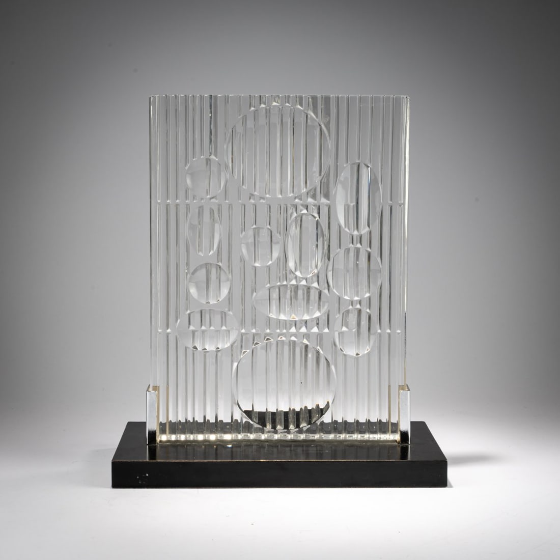 Victor Vasarely , Glass object 'Erebus', 1982 (design): <p>H. 35.5 x 30 x 15 cm. <br />Rosenthal, Selb. <br />Glass, chrome-plated sheet metal, plywood, painted black. <br />Marked: Manufacturer's plaque. </p>