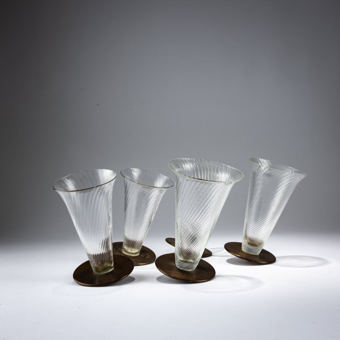 David Palterer, Bo?ek Šípek, Seven tumblers 'Ajeto', c. 1991 (design): <p>H. 15 cm. <br />Ajeto, Lindava, for Alterego Glass, Amsterdam. <br />Brass, crystal glass. <br />Marked: Manufacturer's label (3x).</p>