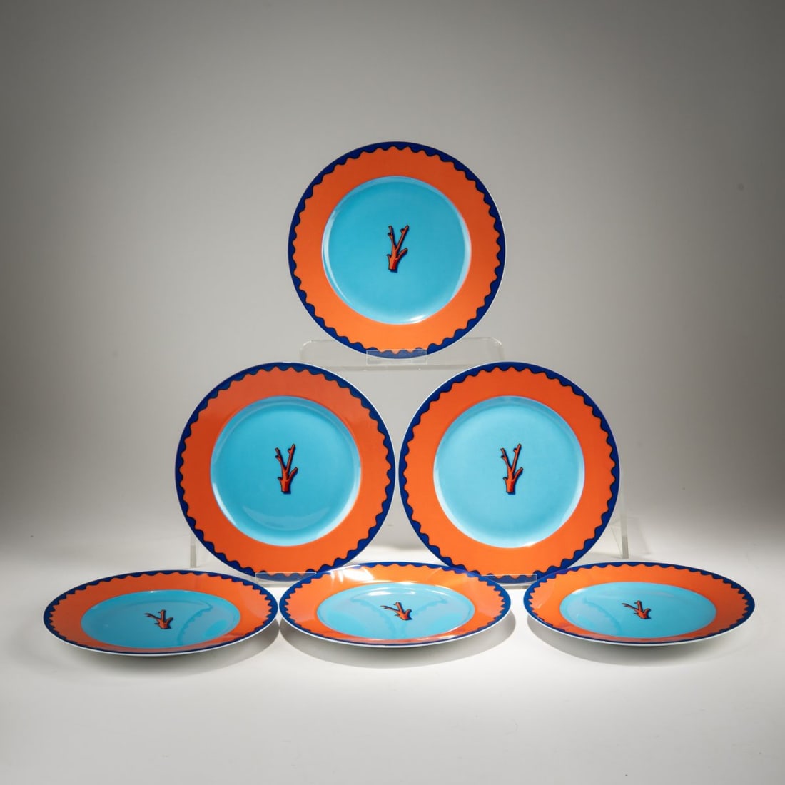 Garouste & Bonetti, Six dinner plates 'Trapani', c. 1989 (design): <p>&Oslash; 26 cm. <br />Ancienne Manufacture Royale, Limoges for Daum, Paris. <br />Porcelain, white, glazed, polychrome overglaze. <br />Marked: Designer's signature and 